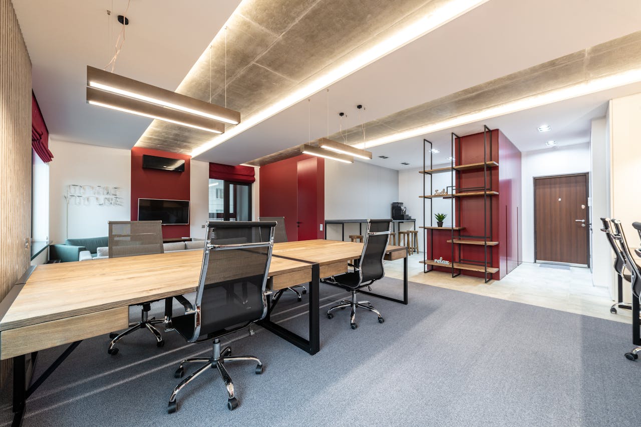 Mastering the First Impression: Your intriguing post title goes here Spacious contemporary office space with wooden desks and modern decor.