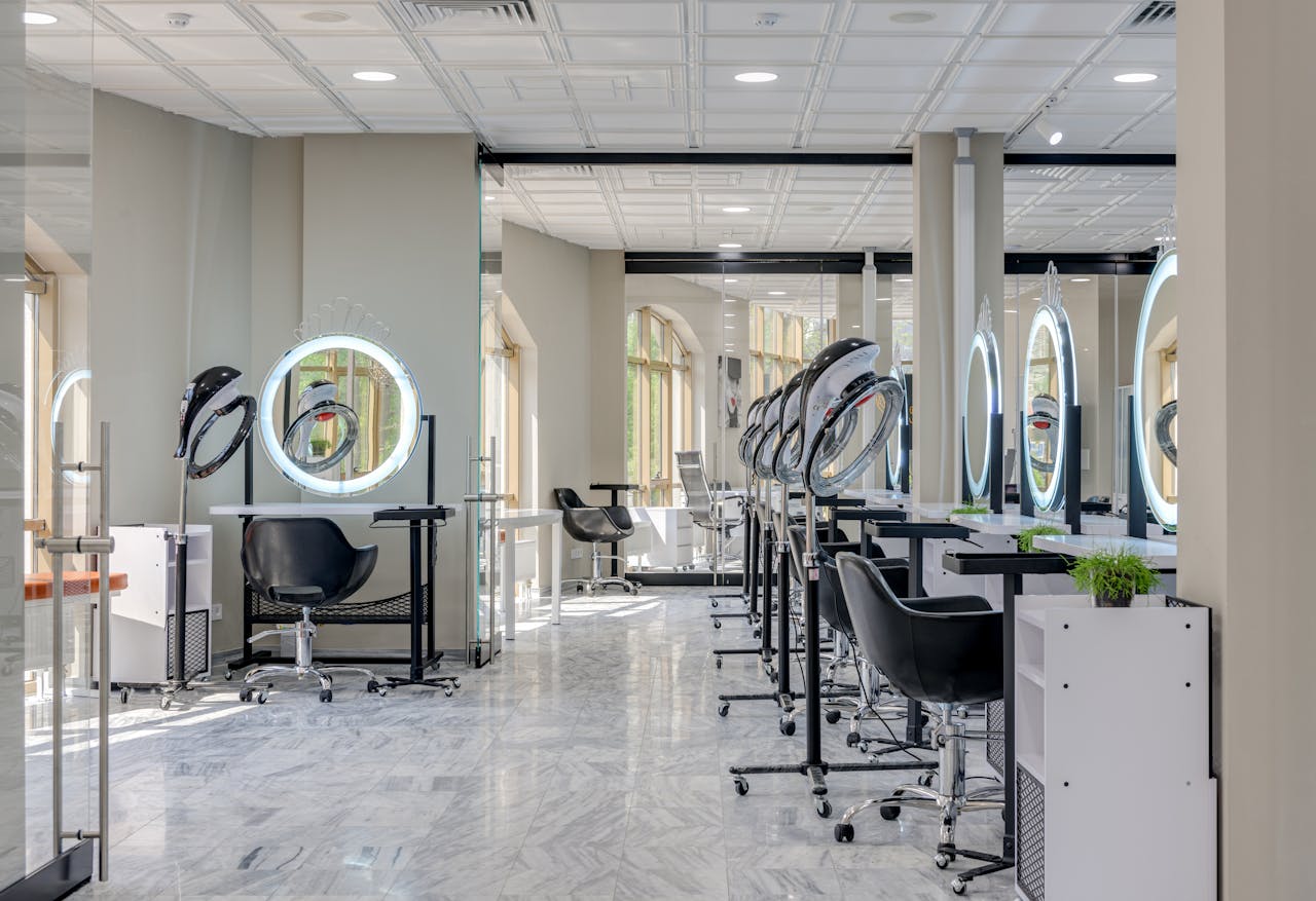 The Art of Drawing Readers In: Your attractive post title goes here Bright and spacious hair salon interior featuring modern design elements and vanity mirrors.